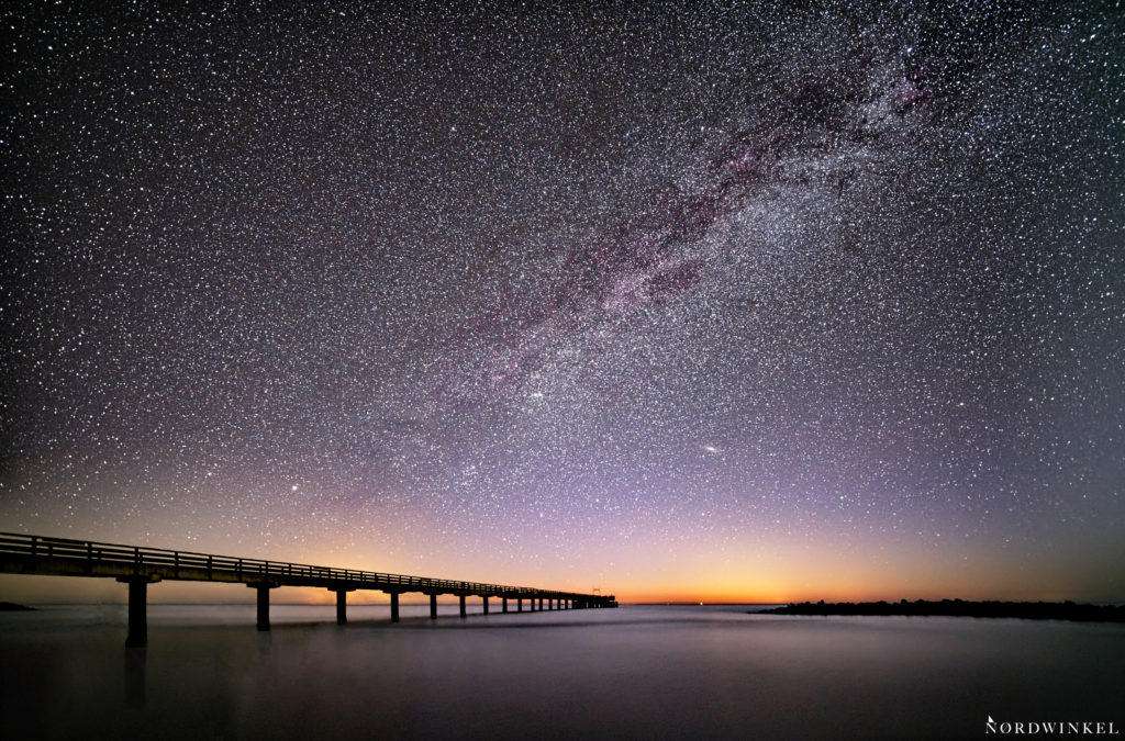 a sky full of stars and the milky way over the baltic sea at the beach in Schönberg